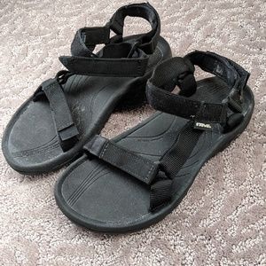 Tevas strap shoes.